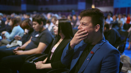 Person yawn at business meet boring lecture speaker. Crowded audience asleep. Expressive face...