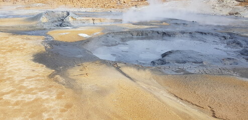 Hverir geothermal area in the north of Iceland near Lake Myvatn, with geothermal lake, looking like Blue Lagoon, Hot Mud Pots and great landscape in the Geothermal Area Hverir, summer day.