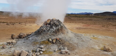 Hverir geothermal area in the north of Iceland near Lake Myvatn, with geothermal lake, looking like...