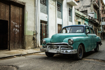 classic 1950s car on urban street in Old Havana