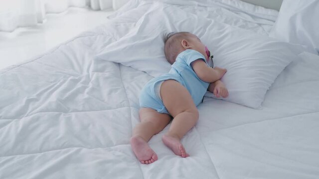 Family concept. The baby is sleeping in the bedroom. 4k Resolution.