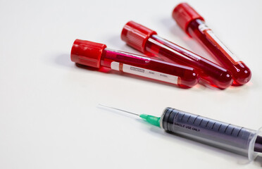 Injection syringe with blood test sample vials of patients