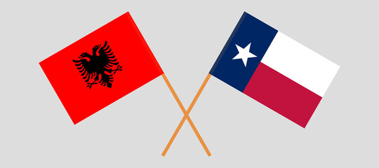 Crossed flags of the State of Texas and Albania
