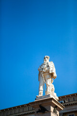 Fototapeta premium The monument of Vittorio Emanuele II in Bergamo, Lombardy, Italy. The statue is made of white marble in the Lower City (Città Bassa) in front of the city hall. European architecture.