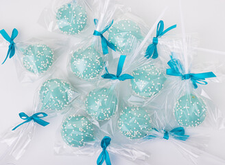 blue lollipops in bags with blue bows