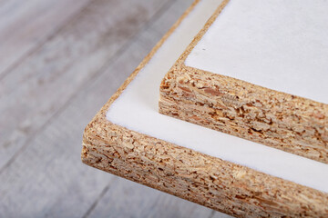 Chipboard with milled side surfaces. Joinery material for furniture construction.