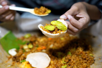 Nasi Goreng Petai or Fried rice served with Bitter Bean and egg at street food market