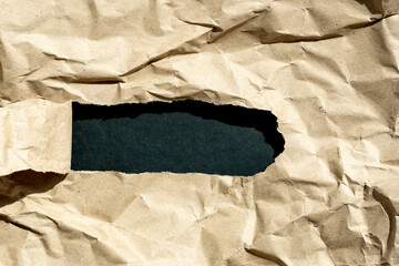 hole in paper with  color paper background inside. Good paper texture.torn hole in...
