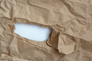 hole in paper with  color paper background inside. Good paper texture.torn hole in...