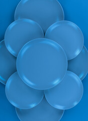 blue kitchen ceramic plates isolated on abstract blue background