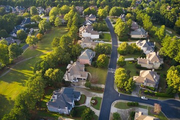Aerial view of beautiful sub division in Suburbs of Georgia with golf course and lake shot during golden hour - obrazy, fototapety, plakaty
