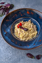 Pasta with ham. Natural delicious food. Greek cuisine menu. Still life in a marine style on a blue background.