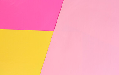 Colored background from paper of different colors. Pink, fuchsia and yellow. Office reminders.