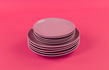 red kitchen ceramic plates isolated on red background