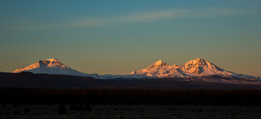 The three sisters mountains in Central Oregon are covered with snow from an early storm