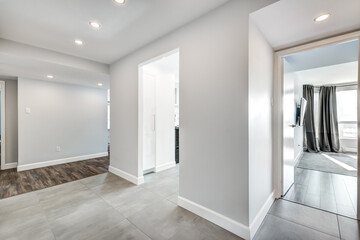 Beautiful empty renovated apartment in an apartment building with bathroom, new kitchen, new floors, all white painted
