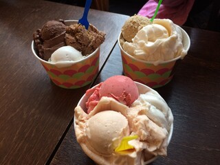 Ice cream with chocolate, ice cream with strawberries. Delicious dessert. Three cups of ice cream
