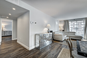 Beautiful empty renovated apartment in an apartment building with bathroom, new kitchen, new floors, all white painted
