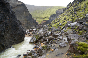 A green mountain with a beautiful river in the 54 km trek from Landmannalaugar, Iceland