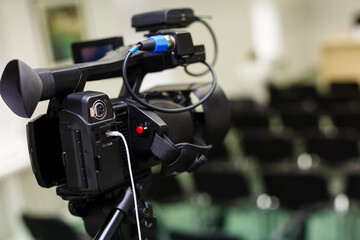 Two professional video camera on tripod. Panasonic camera. Isolated on white background
