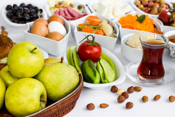Traditional Turkish Spread Breakfast with fresh fruits and vegetables,selected fruit basket,blurred background