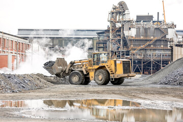 The big bulldozer and industrial pollution. Pollution is the introduction of contaminants into the...
