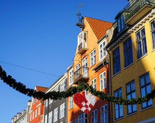 Fototapeta na wymiar Heart and garland across a street in Copenhagen, Denmark