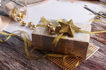 Christmas layout with gift wrapping on wooden background