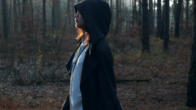 Wanderer in Black Cloak Cowl Walks Through Misty Forest. Wandering Monk Pilgrim. Autumn Morning. Mysterious Traveler. 2x Slow motion 60 fps 4K