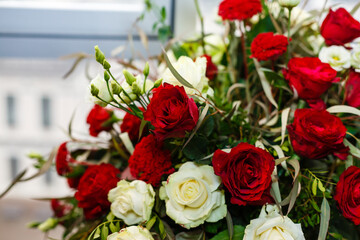Red and white roses, bouquet on a white background with space for text