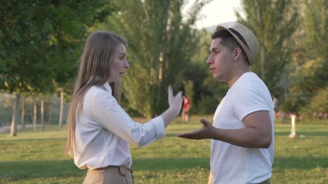 Young couple arguing in the park