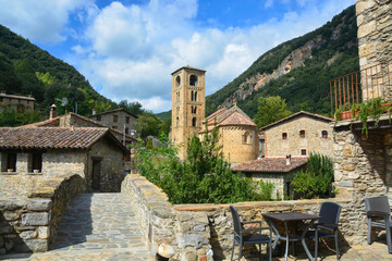 Fototapeta na wymiar BEGET, CATALONIA, SPAIN, EUROPE, SEPTEMBER 2020. Fantastic Romanesque church of Saint Christopher or San Cristóbal, surrounded by stone houses in the beautiful medieval town of Beget