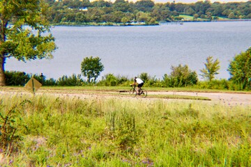 Obraz na płótnie Canvas Biker by lake