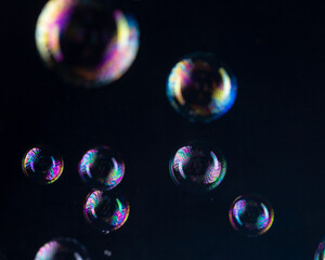 Rainbow bubbles on a black background