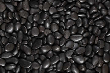 Black river stones texture and background.