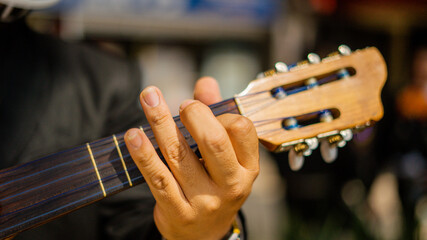 Left Hand of a Mariachi Playing a Mexican Vihuela