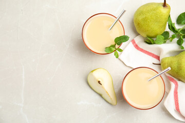 Tasty pear juice with mint and fruits on light grey marble table, flat lay. Space for text