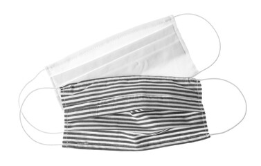 Homemade protective face masks isolated on white, top view