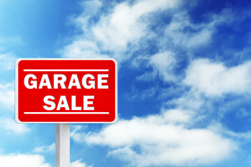 Sign with phrase GARAGE SALE and blue sky