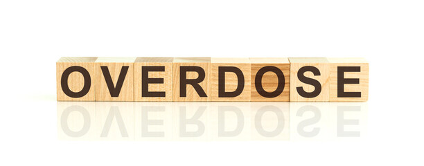 Overdose, word in 3d wooden alphabet letters isolated on white background with copy space