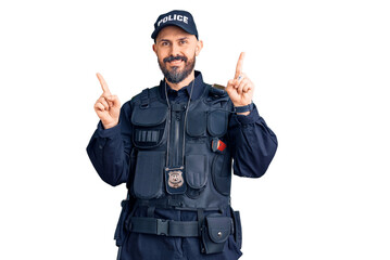 Young handsome man wearing police uniform smiling confident pointing with fingers to different directions. copy space for advertisement