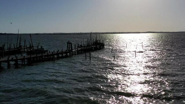 Aerial View of Carrasqueira Stilt Pier and Fishing Boats in Portugal