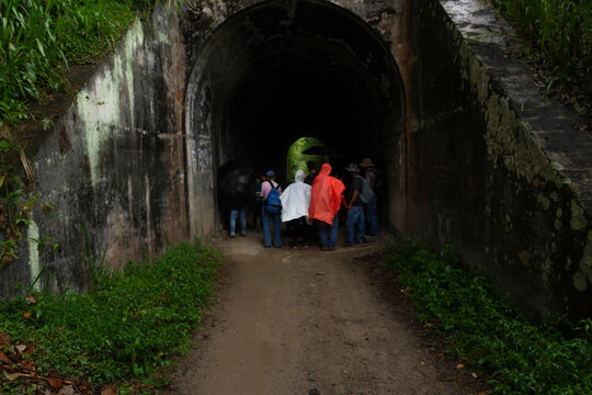 Amaga, Antioquia / Colombia. March 31, 2019. People Emerging From A Dark Tunnel Into The Light