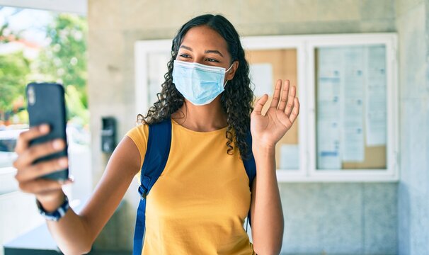 Young african american student girl smiling happy walking at university campus.