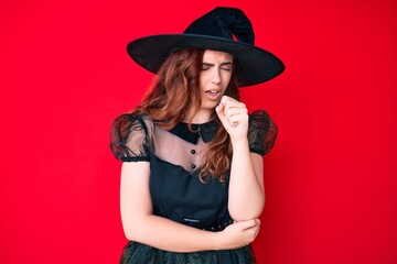 Young beautiful woman wearing witch halloween costume feeling unwell and coughing as symptom for cold or bronchitis. health care concept.