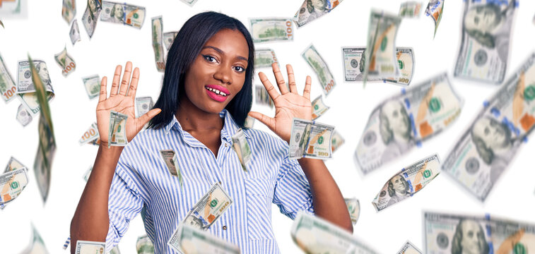 Young african american woman wearing casual clothes showing and pointing up with fingers number ten while smiling confident and happy.