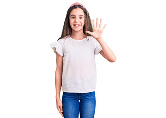 Cute hispanic child girl wearing casual white tshirt showing and pointing up with fingers number five while smiling confident and happy.