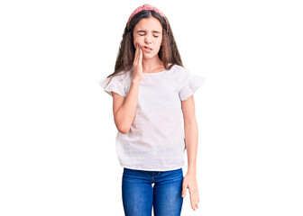 Cute hispanic child girl wearing casual white tshirt touching mouth with hand with painful expression because of toothache or dental illness on teeth. dentist