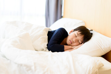 Fototapeta na wymiar Young boy sleeping