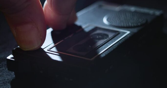 Microcassette Recorder Tape Being Inserted And Switched To Record